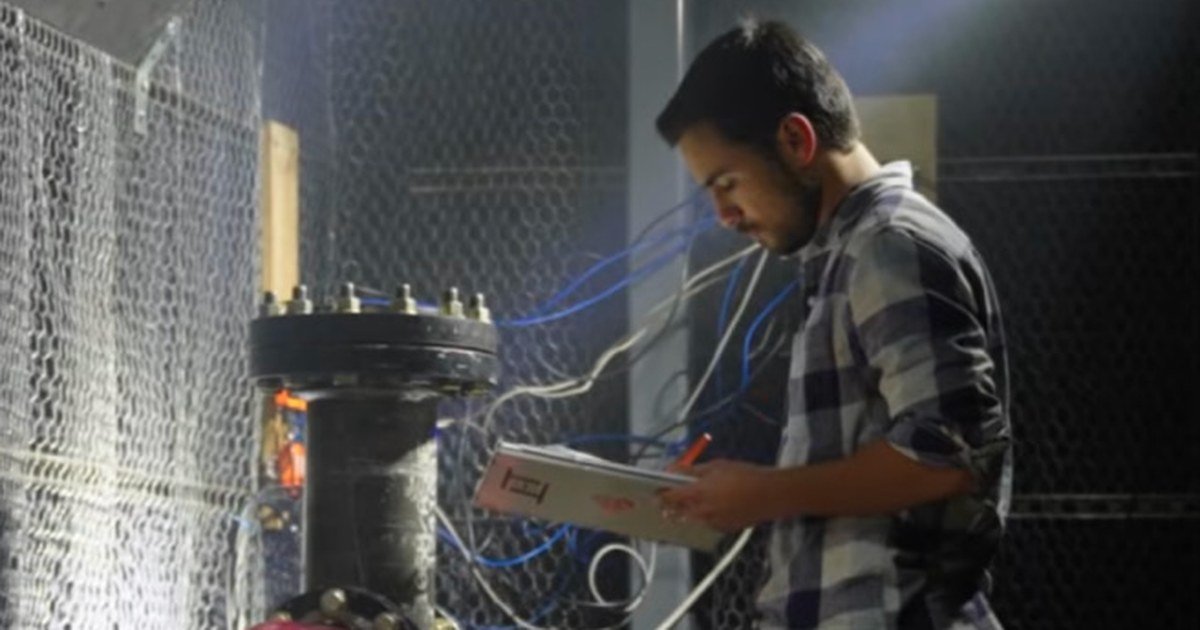 An engineer works on Longshot Space Technologies' pneumatic accelerator test hardware, the kind of ground-based launch technology the company plans to develop at Alameda Point.