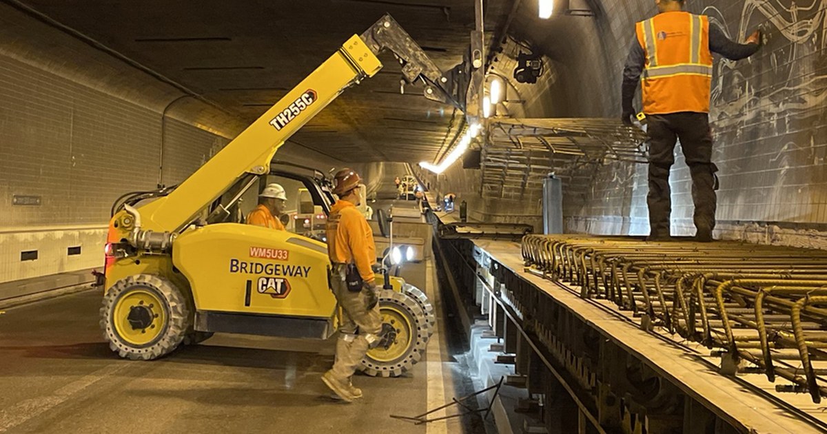 Caltrans construction crews build a new bike and pedestrian path inside Alameda's Webster Tube, placing rebar for concrete sections, in a project photo from June 2026.
